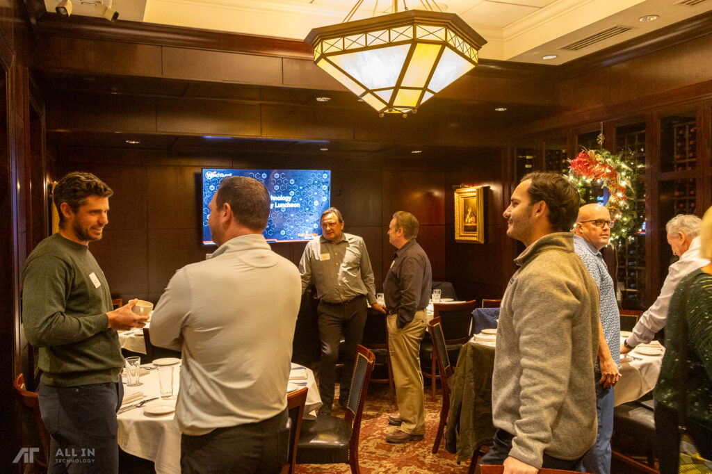 Group of IT leaders discussing All in Technology and Watchguard in denver