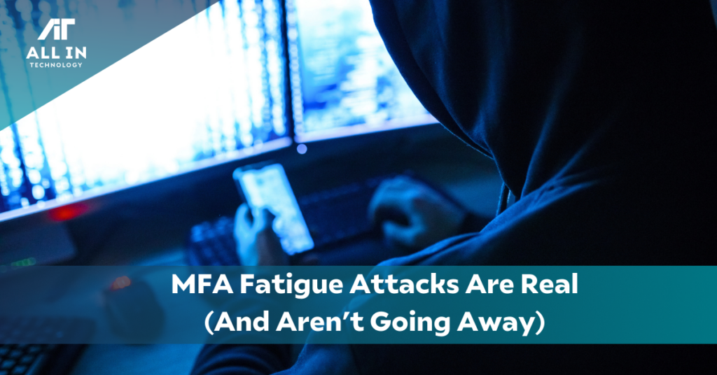 MFA Fatigue Attack from hacker at desk, in the dark, stealing business information All In Technology logo